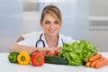 Female dietician with vegetables