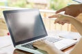 Female director working in coffee shop sitting at desk Royalty Free Stock Photo