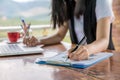 Female director working in coffee shop sitting at desk Royalty Free Stock Photo