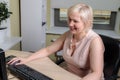 A female director working in an office is sitting at a table, analyzing business statistics, checking documents Royalty Free Stock Photo