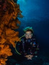 Lady diver and spectacular gorgonian