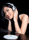 Female DJ in front of turntables