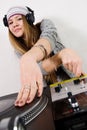 Female DJ scratching the record Royalty Free Stock Photo