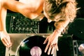 Female DJ at the turntable in Club Royalty Free Stock Photo