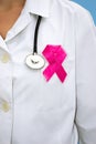 Female doctor with aids ribbon Royalty Free Stock Photo