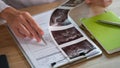 Female doctor analyzes results of patient& x27;s medical examination at her desk in clinic. Royalty Free Stock Photo