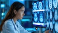 Female doctor analyzing brain scans on computer screens