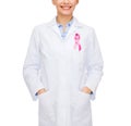 Female doctor with breast cancer awareness ribbon Royalty Free Stock Photo