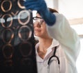 Female doctor check film x-ray image for patient medical care. Surgeon woman examining x-ray film of human body part then Royalty Free Stock Photo