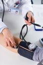 Female Doctor Checking Blood Pressure Of Patient Royalty Free Stock Photo