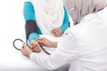 Female doctor checking blood pressure of a patient Royalty Free Stock Photo