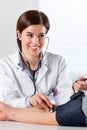 Female Doctor Checking Blood Pressure Of Patient Royalty Free Stock Photo