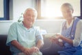 Female doctor checking blood pressure of senior man Royalty Free Stock Photo