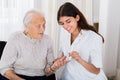 Female Doctor Checking Blood Sugar Level Of Senior Patient Royalty Free Stock Photo