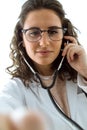 Female doctor checking patient heartbeat using stethoscope. Royalty Free Stock Photo