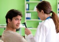 Female doctor checking patient`s ear during medical examination Royalty Free Stock Photo