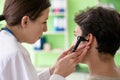 The female doctor checking patient`s ear during medical examination Royalty Free Stock Photo