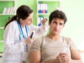 Female doctor checking patient`s ear during medical examination Royalty Free Stock Photo