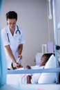 Female doctor checking patient sugar level Royalty Free Stock Photo