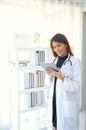 Female doctor checking the treatment results of the patients in a tablet