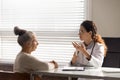 Female doctor consult old woman patient in hospital Royalty Free Stock Photo