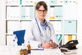 Female doctor at desk Royalty Free Stock Photo