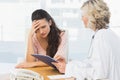 Female doctor discussing reports with patient Royalty Free Stock Photo