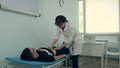 Female doctor doing abdominal examination on male patient Royalty Free Stock Photo