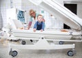 Female doctor examines little boy in pressure chamber