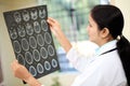 Female doctor examining a brain scan Royalty Free Stock Photo