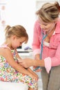 Female doctor examining child Royalty Free Stock Photo