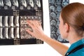 Female Doctor examining MRI image