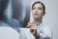 Female doctor examining x-ray image Royalty Free Stock Photo