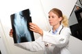 Female doctor examining an x-ray image Royalty Free Stock Photo