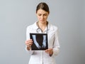 Female doctor examining x-ray image of legs of newborn baby Royalty Free Stock Photo