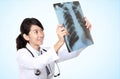 Female doctor examining an x-ray Royalty Free Stock Photo