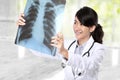 Female doctor examining an x-ray Royalty Free Stock Photo