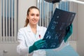 A female doctor examining an x-ray picture Royalty Free Stock Photo