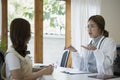 Female doctor explaining diagnosis to her patient. Royalty Free Stock Photo