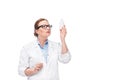 female doctor in eyeglasses looking at pill bottle