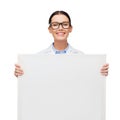 Female doctor in eyeglasses with white blank board Royalty Free Stock Photo