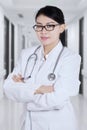 Female doctor folded hands in hospital Royalty Free Stock Photo