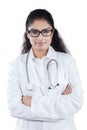 Female doctor folding arms Royalty Free Stock Photo