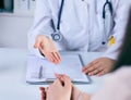 Female doctor giving a consultation to a patient and explaining medical informations and diagnosis. Just hands over the Royalty Free Stock Photo