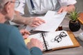 Female doctor giving prescription to her patient Royalty Free Stock Photo