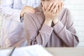 Female doctor hand comforting depressed patient at a hospital Royalty Free Stock Photo