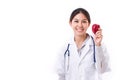 Female doctor with hand holding red apple