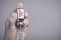 Female doctor hand wearing white grove and holding syringe and COVID-19 vaccine. Healthcare and medical concept Royalty Free Stock Photo