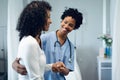 Female doctor helping female patient to walk in the ward at hospital