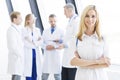 Female doctor and her team Royalty Free Stock Photo